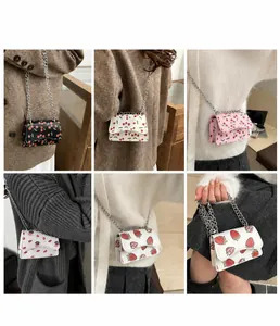 Detail shots of mini chain flap bags with cherry, strawberry, and lip prints on textures