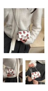 Mini white leather bag with strawberry prints and silver chain strap details