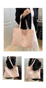 Detail of pink striped canvas tote bag showing thick fabric texture and woven label