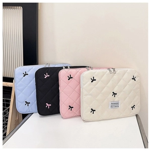 Quilted nylon tablet sleeve with bow embroidery and zipper in four pastel colors