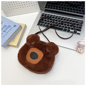 Close-up of soft plush brown bear head crossbody bag with adjustable strap and cute 3D face