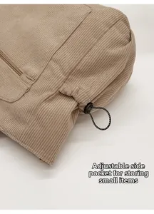 Detail of adjustable corduroy side pocket with black drawstring and spring buckle