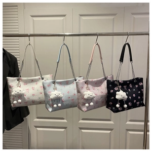 Detail view of floral bucket bags in four colors with chain straps and cloud charms