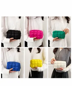 Quilted cosmetic bags in multiple colors shown held by models in a grid layout display