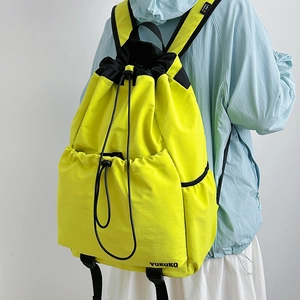 Bright yellow drawstring sports backpack with black straps and side storage compartment