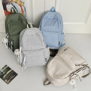 Pastel plaid backpacks in green blue grey and beige with cute charms for students
