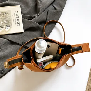 Top view of brown leather crossbody bag showing large capacity for daily essentials