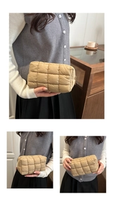 Details der khakifarbene gesteppte Handtasche mit Gitterstich und Metallreißverschluss