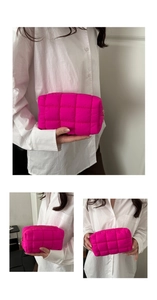 Detailansicht der neonpink gesteppten Kosmetiktasche mit Reißverschluss und Puffer-Textur
