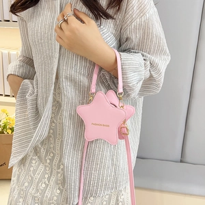 Chic pink star-shaped PU leather crossbody bag with golden fashion text and adjustable strap