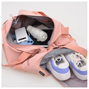 Top view of pink nylon sports bag showing large capacity storage and shoe compartment