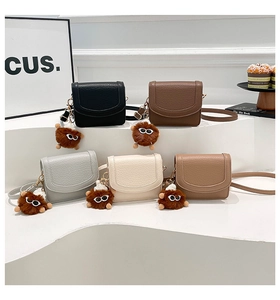 Litchi pattern leather underarm bags in five colors with plush monster charms
