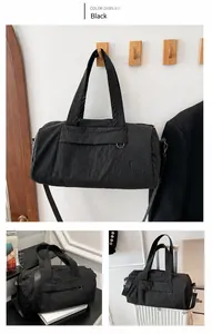 Détails du sac de sport en nylon noir avec poignées renforcées et bandoulière réglable