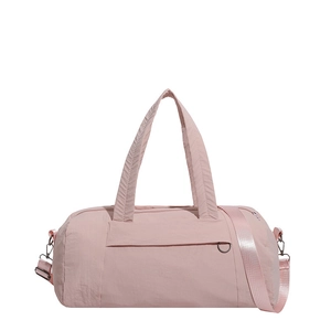 Pink nylon cylindrical duffel bag with reinforced handles and adjustable shoulder strap