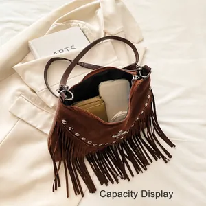 Capacity display of vintage dark brown tassel shoulder bag showing daily essentials