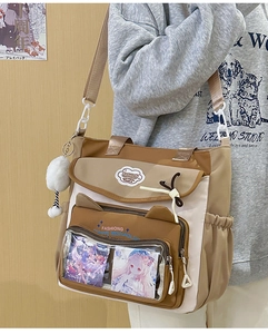 Detail of nylon crossbody tote bag featuring cute cat ears and clear window pocket