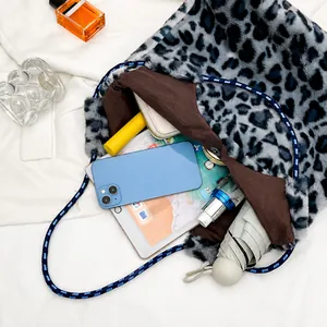 Interior view showing the large capacity of this blue leopard print plush tote bag