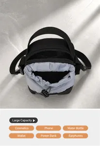 Crossbody bag internal view showing compartments for phone, water bottle, and accessories