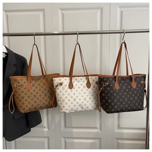 Three large capacity tote bags in khaki, white and dark brown with logo pattern detail