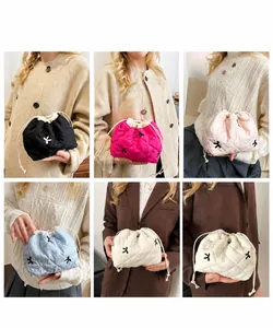Quilted drawstring bucket bag detail showing multiple colors and embroidery on different outfits