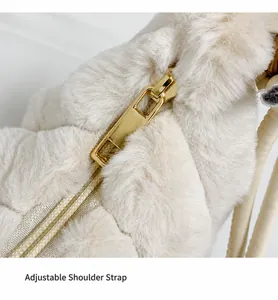 Close-up of fluffy plush bag featuring a high-quality gold metal zipper detail