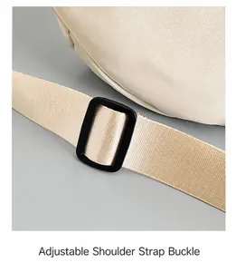 Close-up of beige nylon wide strap with a black plastic adjustable buckle on chest bag