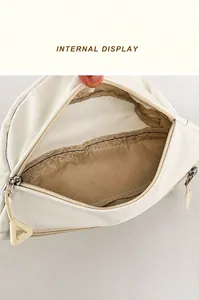 Internal display showing spacious storage compartment and triangular zipper of white bag