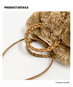 Macro view of woven leather handles and plush brown faux fur texture on the tote bag