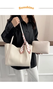 Cream tote bag set with pink polka dot scarf shown on a model in leather jacket