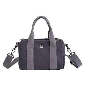 Lightweight mauve canvas crossbody square bag with top handles and adjustable strap