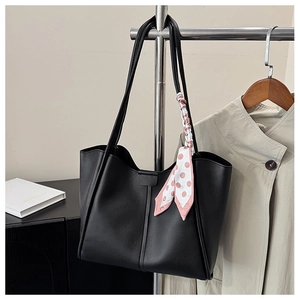 Classic black PU leather tote bag with polka dot scarf detail on long shoulder straps