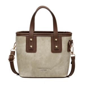 Sac seau rétro en toile beige et cuir marron pour le trajet quotidien des femmes