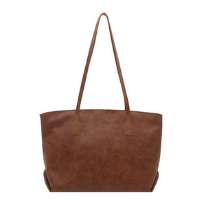 Vintage brown PU leather tote bag with long shoulder straps on white background