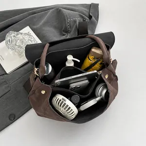 Top view of large capacity coffee brown tote showing organized tablet, umbrella, and gadgets