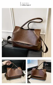 Detail of dark brown tote bag with adjustable leather and wide fabric shoulder straps