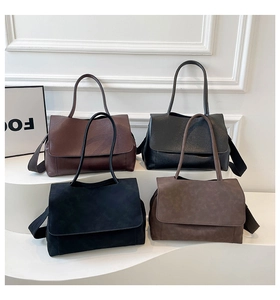 Detail view of large tote bags in four colors with wide woven shoulder straps
