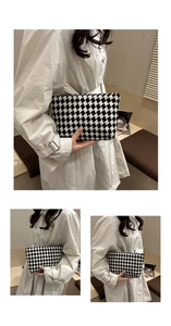 Detail of checkered woven long wallet featuring black and white grid pattern for women