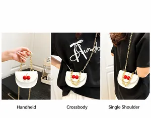 Detail showing three ways to wear the white cherry mini bag with gold chain straps
