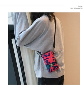 Mini floral crossbody phone bag with abstract rose and blue patterns with Sport logo