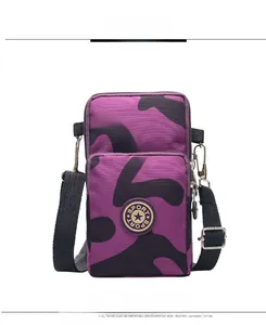 Detail view of purple camo phone bag with double zippers and sport logo patch