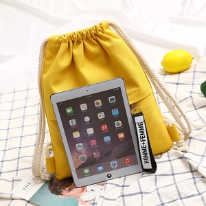 Bright yellow canvas drawstring backpack for students with large capacity for tablet