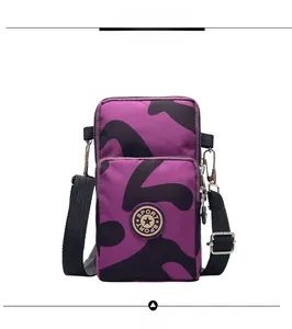 Front view of purple camouflage sports crossbody bag with dual zipper compartments