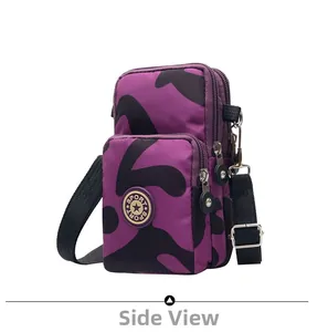Detail of purple camo crossbody phone bag with double zippers and sport logo