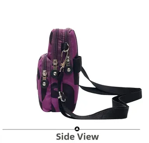 Side view of purple nylon crossbody phone bag featuring multi-layer zippers and side profile