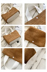 Detail view of woven straw tote bag with white leather patchwork and metal magnetic buckle