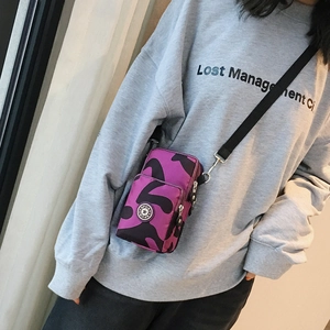 Vertical mini crossbody phone bag with purple camouflage print and two zipper compartments