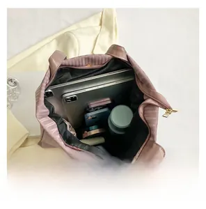 Top view of large pink tote bag showing spacious interior for laptop and daily essentials