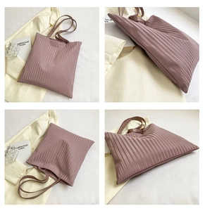 Detail shots of pink pleated tote bag from multiple angles with magnetic snap closure