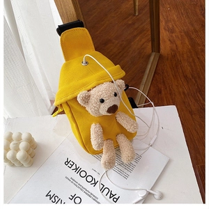 Detailed view of yellow canvas chest bag with 3D teddy bear and built-in headphone port