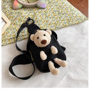 Detailed close-up of cute 3D plush bear on black canvas chest bag for teen girls